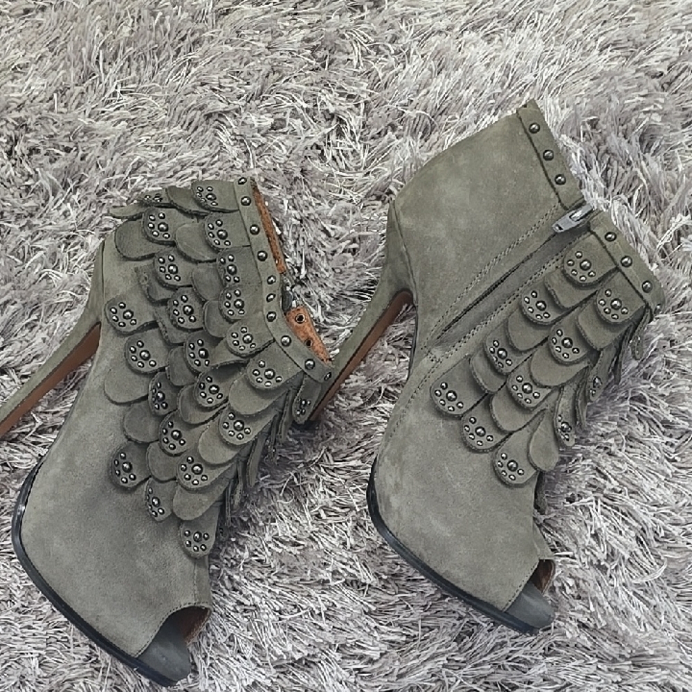 Gray Heeled Boots with Durable Construction and Rugged Sole